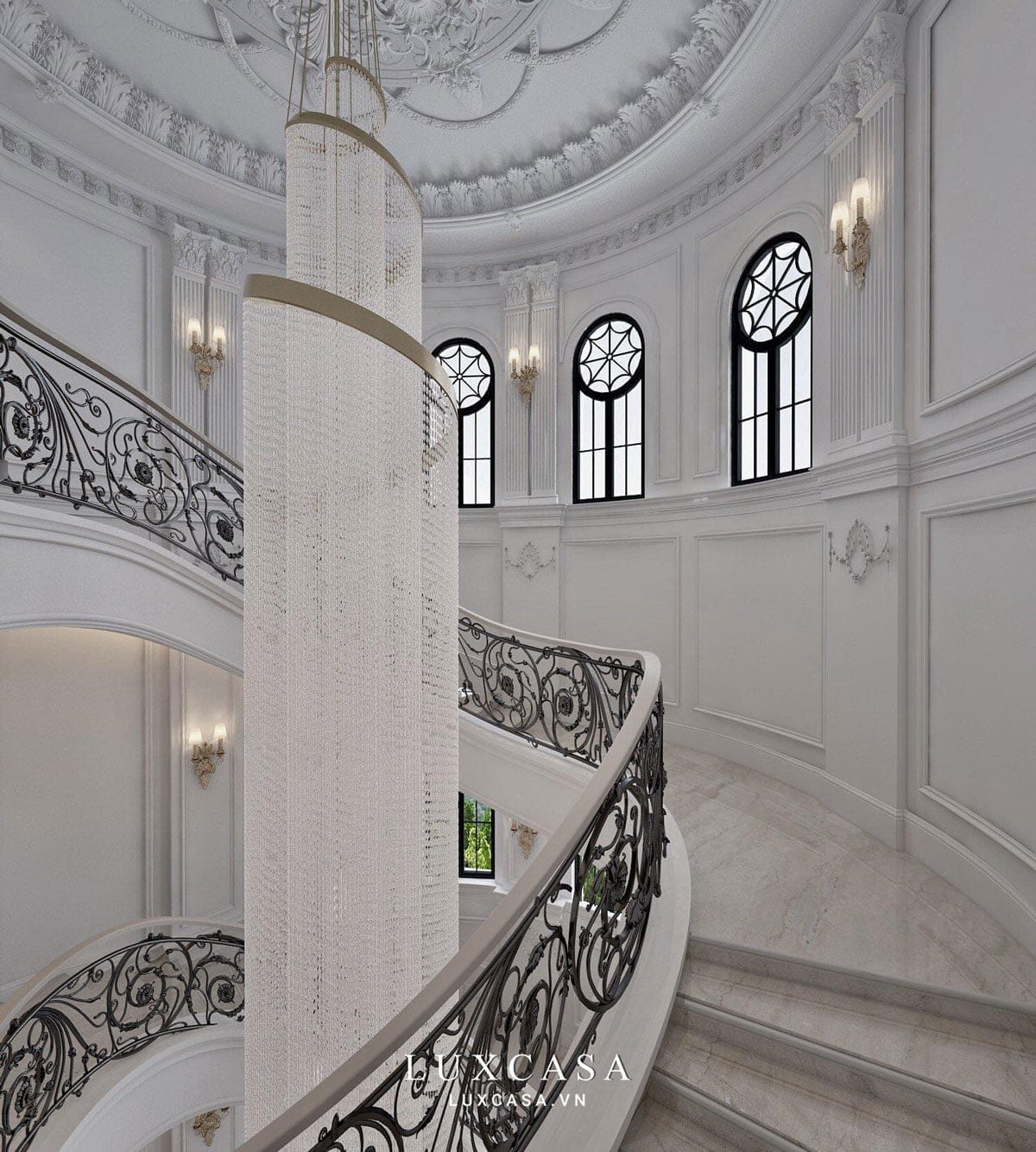 Lối đi lên cầu thang với tay vịn chạm trổ tinh xảo và đèn thả dài